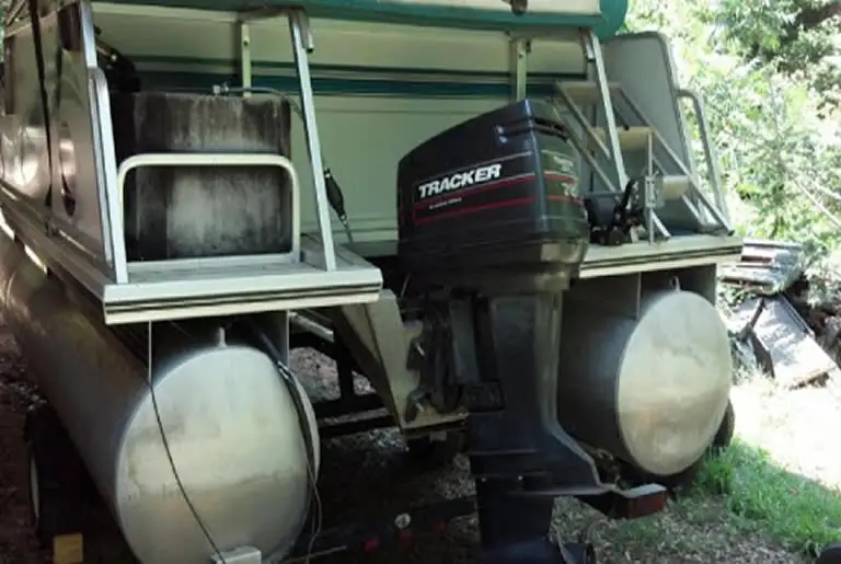 Gas tank above tubes on pontoon boat