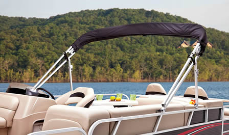 Folded bimini top on pontoon boat