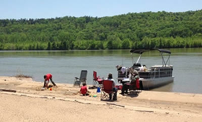 beached pontoon boat party